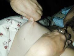 squashing her nipple with a full force pinch